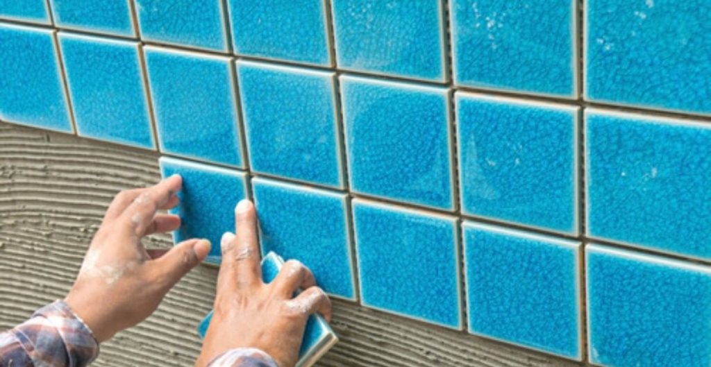Swimming pool tile repair and regrouting