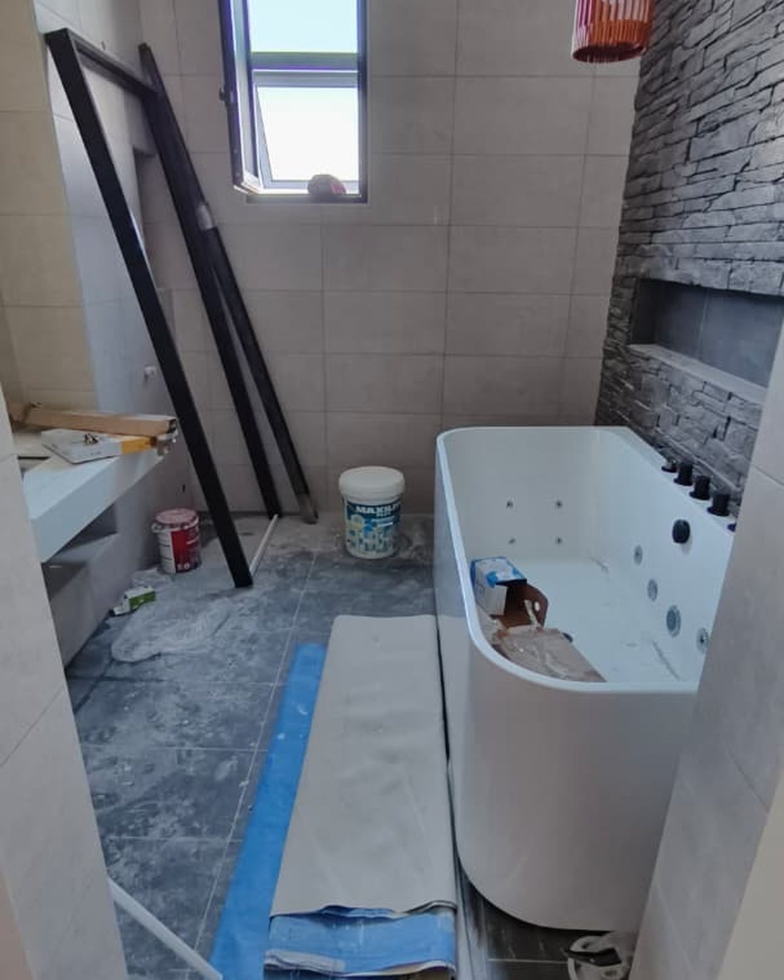 Bathroom post-renovation before cleaning